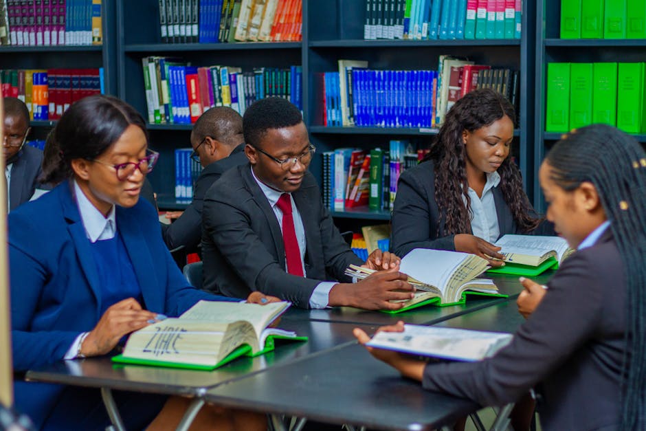 Focused group of adults studying in a library, fostering education and collaboration